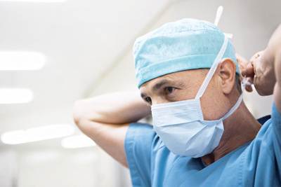 Doctor putting a mask on