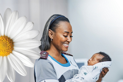 Nurse holding a newborn baby