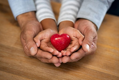 Holding a heart in hands