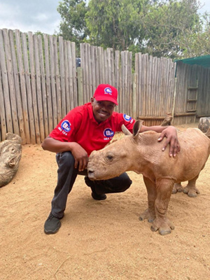 Moses with Daisy the rhino
