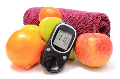 Glucometer, fresh fruits and dumbbells with purple towel