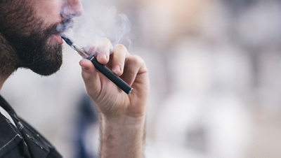 E-cigarette close-up with a cigarette