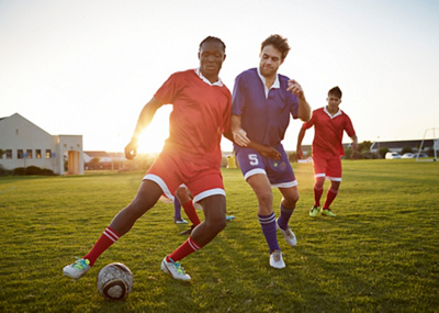 Ecstatic footballer on his knees