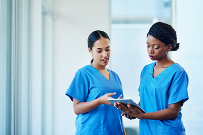 Two women nurses talking