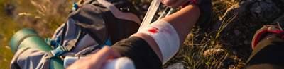 Person bleeding with bandage