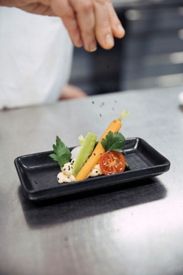 Koch verfeinert Menü