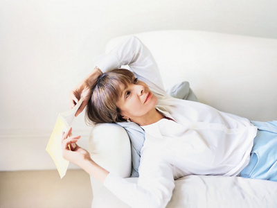 A woman relaxing on the sofa. 