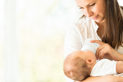 Mother touching her baby's face