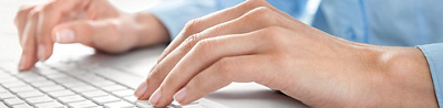 Person working on computer keyboard