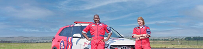Two ER24 paramedics next to an ambulance