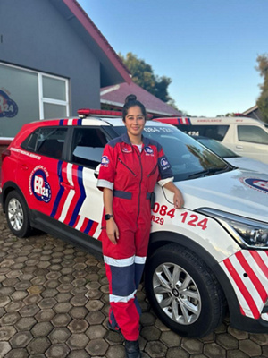 Raeesah Boomgard standing at an emergency vehicle